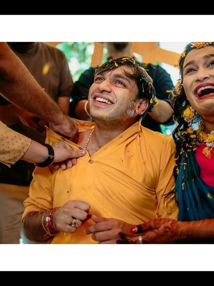 The couple sharing a laugh as they get covered in Haldi by their loved ones. This is the beautiful, unscripted chaos I love to document.