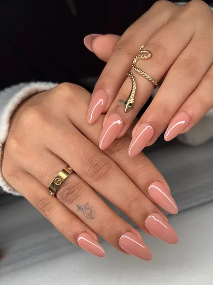 The full two-hand view of the classic nude almond manicure. This is a go-to look for a clean, sophisticated, and polished appearance.