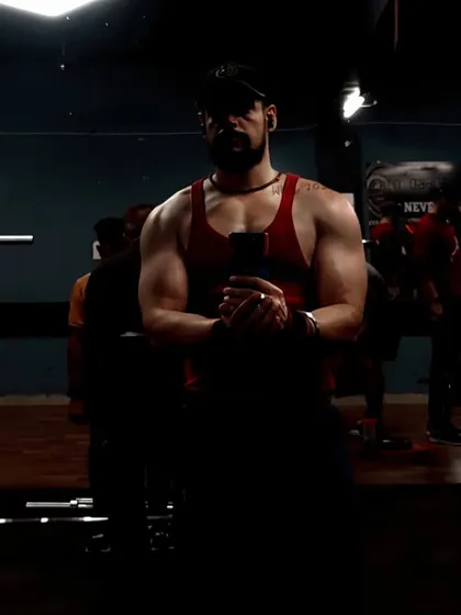 The same animal intensity, captured with dramatic lighting. A strong physique is forged in the shadows of hard work before it's revealed in the light.