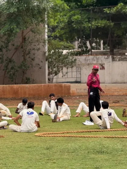 A coach leads the cool-down stretches, an essential part of post-match recovery.