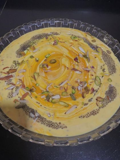 This is my healthier take on Mango Shrikhand. I mix mango pulp with Greek yogurt and cream, then garnish with nuts and soaked chia seeds. This adds protein and healthy fats, which helps to lower the glycemic load of the dessert.