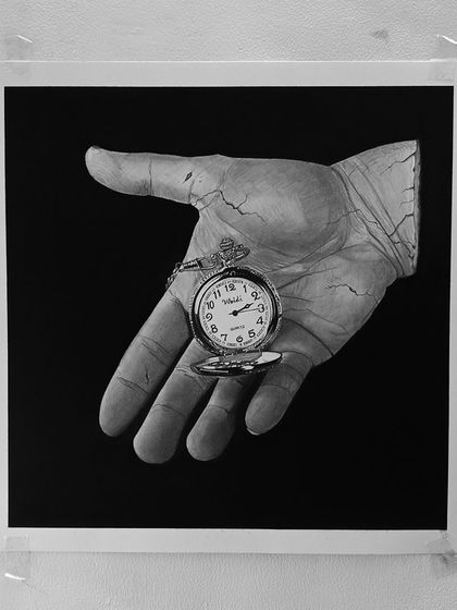 The "Time" drawing, taped to the wall. The cracks in the hand were a last-minute addition that I think really made the piece.