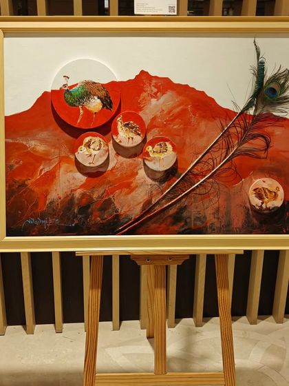 A unique mixed-media artwork from the 'Ethereal Charm' exhibition, incorporating a real peacock feather into the painting.