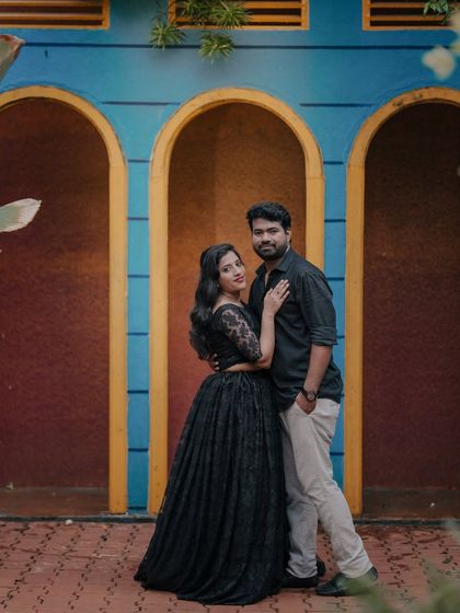 A cool and stylish pose in the blue and yellow arched doorways.