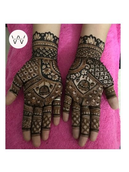 A detailed back-hand design for a bridesmaid, with a mix of geometric and floral patterns.