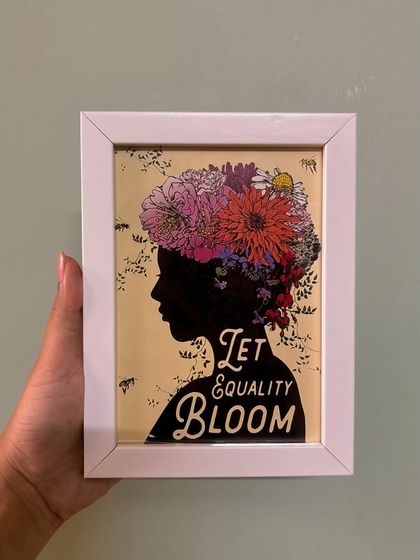 A powerful message in a frame: "Let Equality Bloom." This custom piece features a beautiful silhouette and floral design, perfect for adding an inspiring touch to any space.