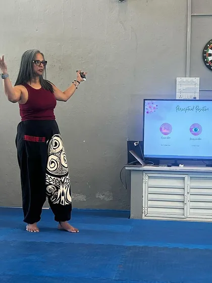 Our wellness mentor explains the concept of "Perceptual Positions," a tool for understanding different perspectives and improving communication within the team.