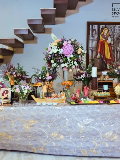 We create stunning, abundant grazing tables that become the centerpiece of any celebration. This beautiful spread for a birthday features a sushi boat, fresh fruit platters, and a variety of gourmet appetizers, all elegantly styled with fresh flowers.