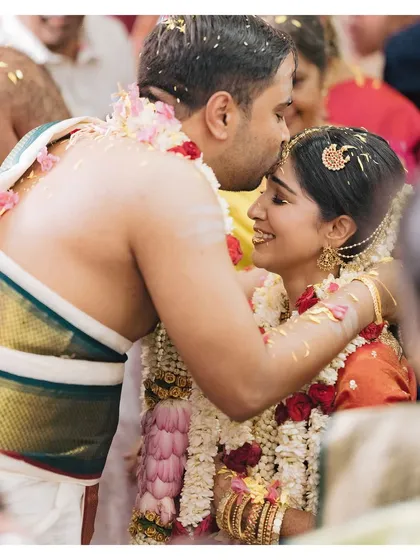 A tender forehead kiss during Venkai and Sruthi's South Indian wedding. This is a classic, emotional moment that I always look for, capturing the blessings and love of the day.