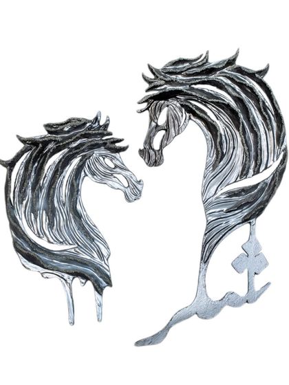 The two "Eternal Horse" sculptures together. They tell a story of resilience and honor, from desert sands to shining skylines.