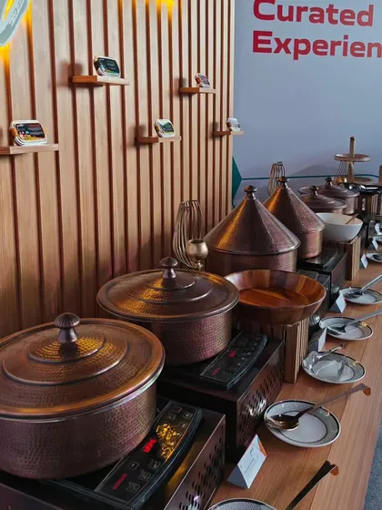 A detailed look at the 'Gourmair' buffet line. We curated an experience that mimicked a first-class in-flight meal service, using authentic serveware to bring the theme to life for all the guests.