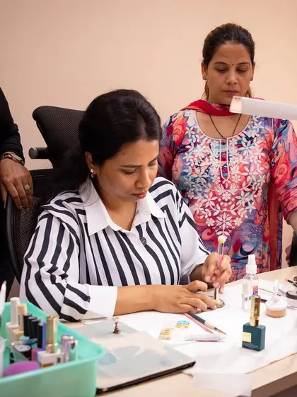 Sharing my passion is as important as creating it. Here I am during one of my nail art seminars, demonstrating techniques and guiding my students as they create their own beautiful designs.