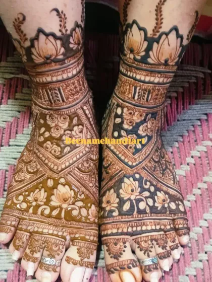 Your bridal look isn't complete without beautiful mehandi on your feet. This is a great example of a full coverage design with delicate lotus motifs and intricate patterns that look stunning.