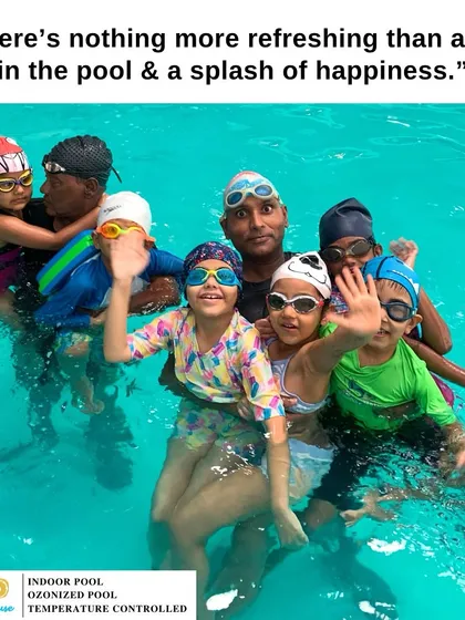 A happy group of kids with their coach. There's nothing more refreshing than a dip in the pool and a splash of happiness with friends.