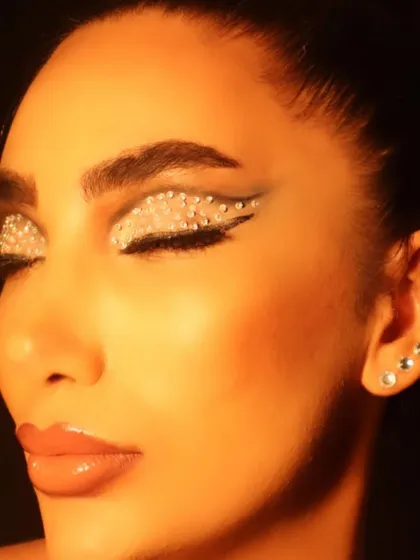 This is where makeup becomes art. I used individual rhinestones to create a full-lid, graphic winged liner effect, perfect for a high-fashion editorial or a bold portfolio piece. The focus is on texture and light, ensuring the look is dramatic and catches the eye under any lighting.