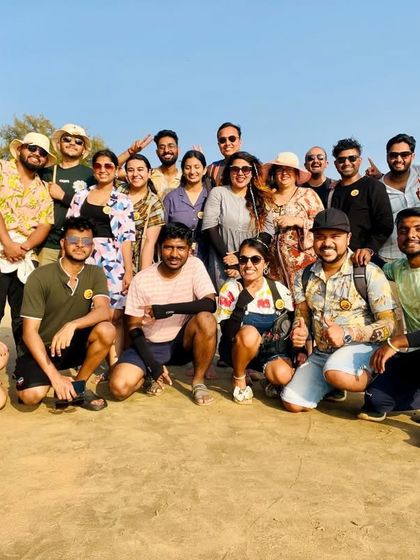 All smiles on the sunny shores of Gokarna. Our beach trips are perfect for making new friends and soaking up the coastal sun.