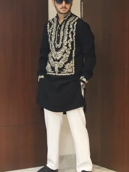Another angle of the client in the black and gold kurta.