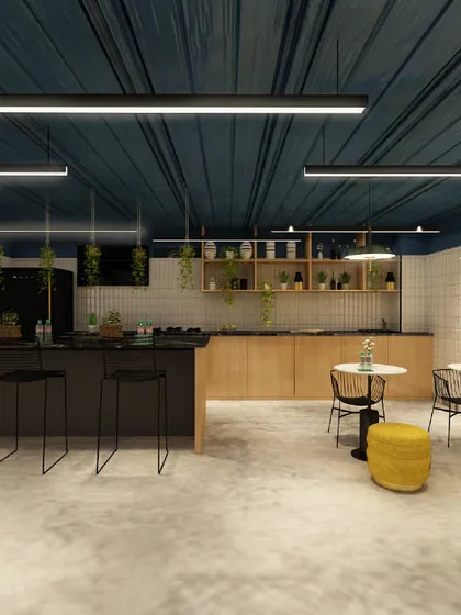 The office pantry and bar area, designed with a clean, modern aesthetic. The space includes a long counter with bar stools and simple, functional furniture.