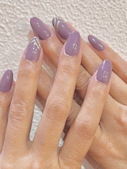 Opera mauve nails with a touch of sparkle. This elegant look features a beautiful mauve polish with a subtle silver glitter accent along the cuticle.