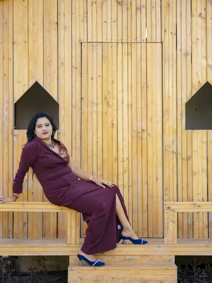 A relaxed and elegant pose on the porch of our wooden cabin set. This is perfect for a calm and beautiful solo photoshoot.