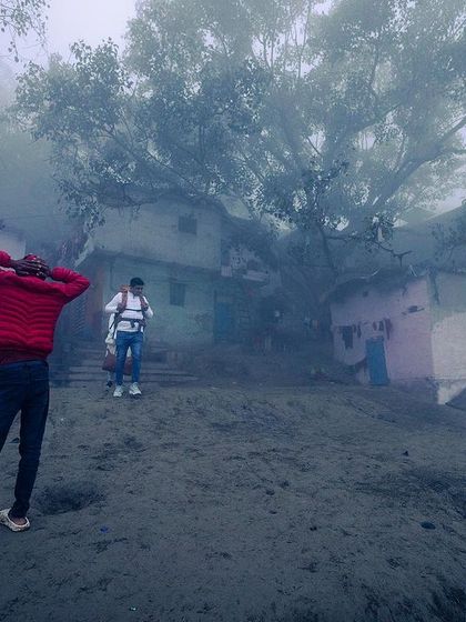 Figures are seen through the thick fog at Yamuna ghat, their forms becoming part of the atmospheric and almost abstract landscape.