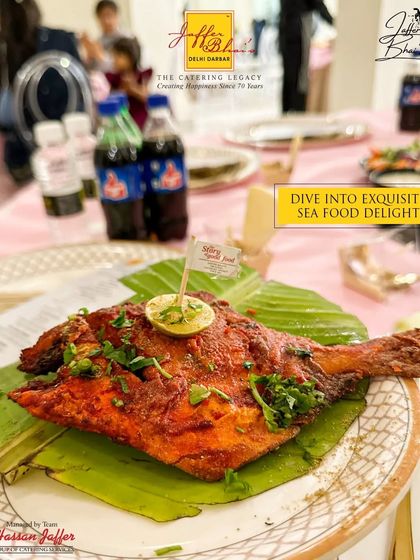 Dive into exquisite seafood delights with our Tandoori Pomfret. The whole fish is marinated in a rich blend of spices and cooked to perfection, served on a banana leaf for an authentic and flavorful presentation.