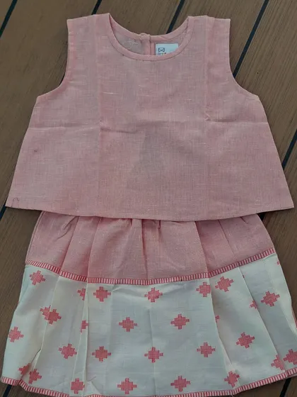 This is the same handwoven cotton skort set that I am obsessed with. The fabric is breathable, the box pleats give it a lovely flare, and the pastel tones are so sweet.