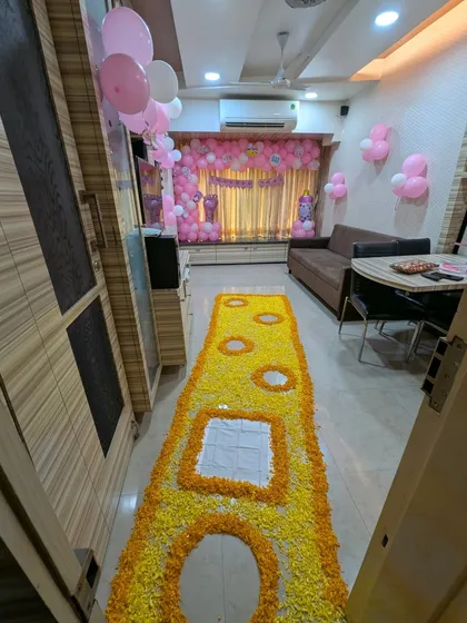 This perspective shows how the floral pathway and the balloon backdrop work together to fill the space with color and joy. We ensure every element is coordinated for a picture-perfect celebration.