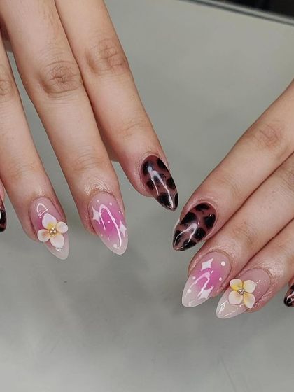 Another view of the mixed-media nail art, showing how the different patterns and textures work together for a unique look.