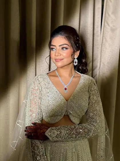 A beautiful profile of Ruchita, showing how the makeup enhances her features for a stunning evening look.