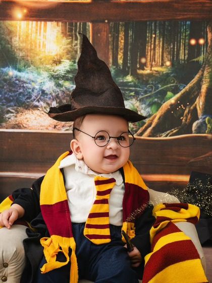 The sorting hat has spoken. This baby is ready to begin his magical education in this enchanting Harry Potter setup.