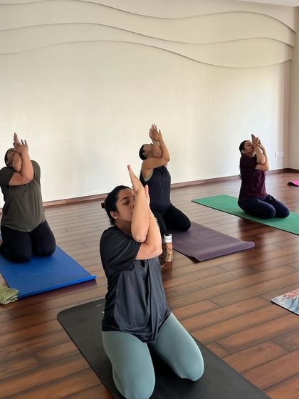 Here, we are practicing the arm variation of Gomukhasana, or Cow Face Pose. This is a fantastic shoulder stretch that helps to relieve the upper back and neck tension that often accompanies pregnancy.