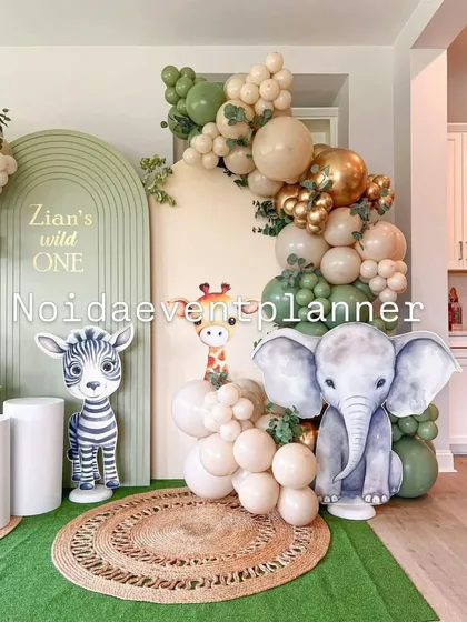 Our 'Wild One' jungle safari theme uses soft, earthy balloon colors and adorable animal cutouts like an elephant and zebra to create a cute and stylish backdrop.