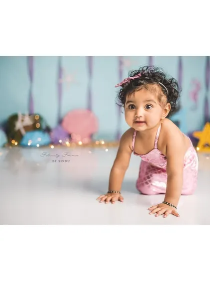 A little mermaid on the move! This crawling shot captures her energy and the beautiful details of her costume.