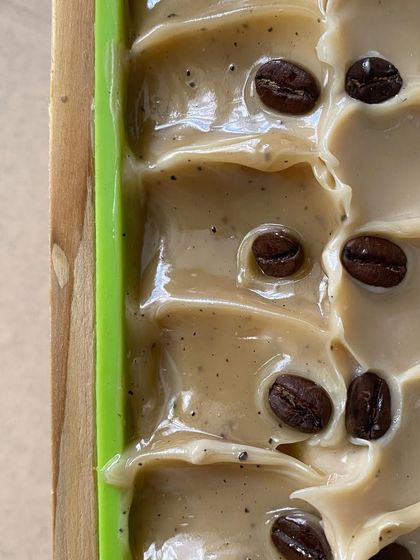 The satisfying look of a freshly poured wet soap top, this one featuring our coffee soap decorated with whole beans.