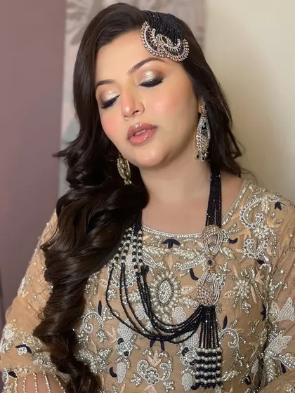 A close-up of this client's royal and elegant look. The gold and black smokey eye is dramatic and sophisticated.