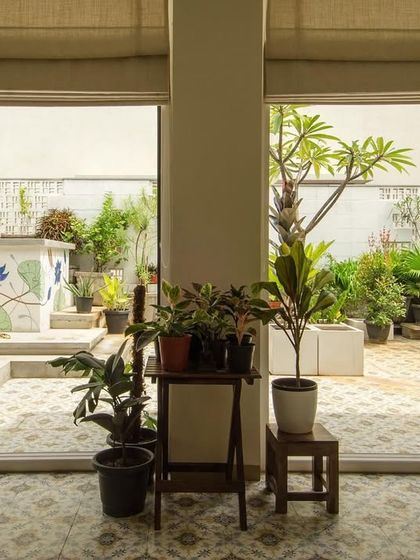 A view from the new terrace room out to the garden. We believe a home is as much about its outdoor spaces as its indoors. Here, architecture provides the backdrop for life to unfold.
