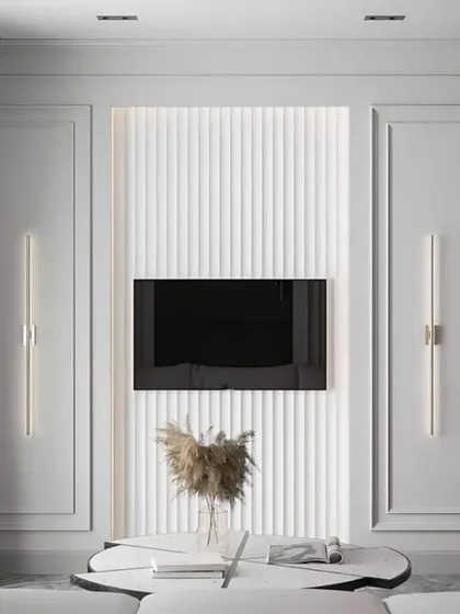 An ultra-modern TV wall with white fluted paneling and minimalist vertical light fixtures. This design is perfect for creating a serene and sophisticated ambiance.