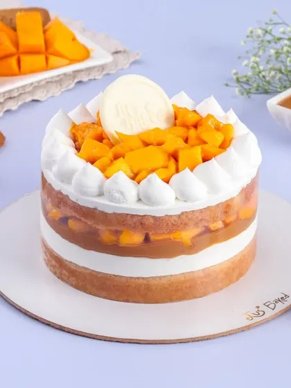 This image shows three of my limited-edition mango specials: the light Mango Vanilla, the rich Chocolate Mango, and the unique Mango Biscoff. All are eggless and made with only fresh mangoes.