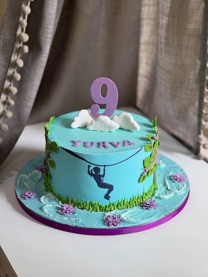 A cake as wild and free as the birthday girl herself. For a 9-year-old who loves hiking and ziplining, this nature-themed cake celebrates her fearless and adventurous spirit.