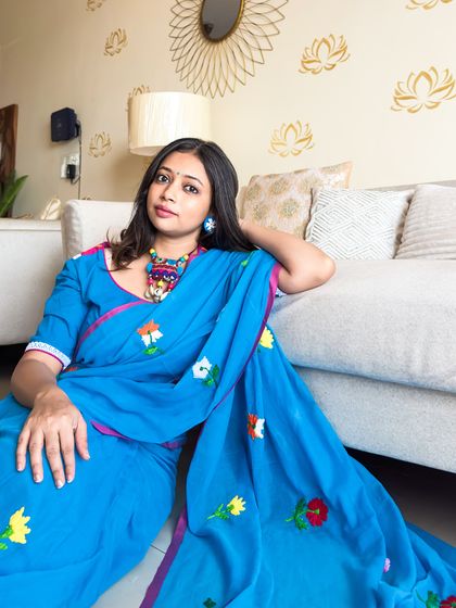 Another shot showing the full spread of the saree. The vibrant blue is such a happy color, and the floral embroidery adds to its charm.