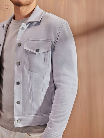 This is for when a blazer feels like too much. The suede shacket in a soft grey is a perfect layering piece, offering a relaxed fit that is still luxe and contemporary.