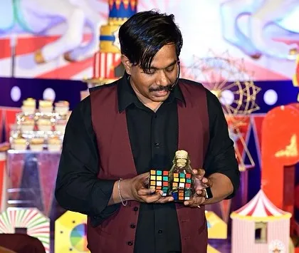 Even on a big stage, the Rubik's cube is a powerful tool for magic. Here I am performing a cube magic routine during a child's birthday show.