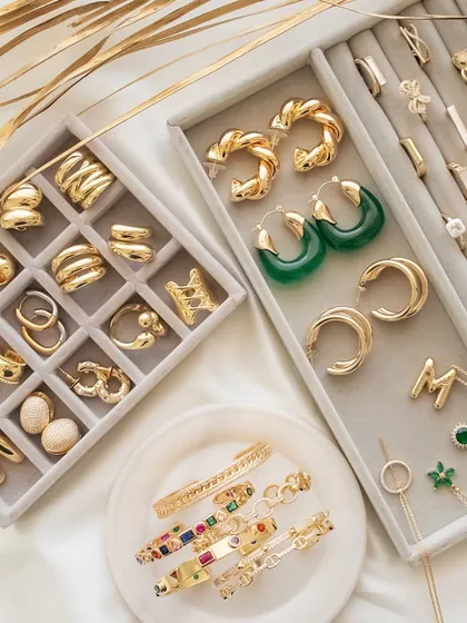 Upgrade your look with these must-have pieces. This flat lay shows off some of my favorite chunky rings, hoops, and necklaces.