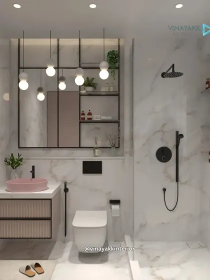 I transform bathrooms into personal spa retreats. This design uses large-format marble for a timeless, luxurious feel, contrasted with modern matte black fittings. A pop of color from the pastel pink basin and the texture of the fluted vanity add a unique, designer touch to this compact space.