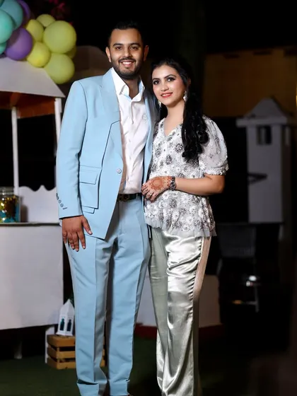 A smiling couple poses for a portrait during the birthday celebration. I make sure to capture beautiful photos of the hosts and their guests.