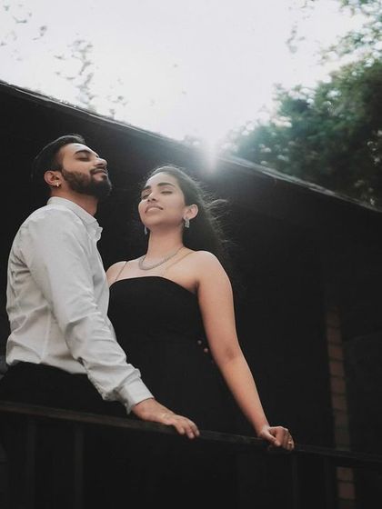 A couple enjoying the sunlight on a rustic balcony. I look for natural light and interesting locations to create pre-wedding photos that feel authentic and beautiful.