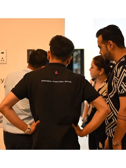 A shot from behind, showing our team member's branded shirt which lists our core services: Automation, Audio-Video, and Security.