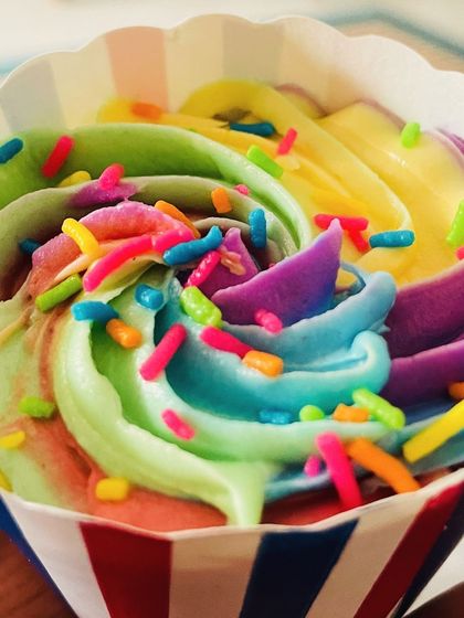 An extreme close-up of the rainbow frosting and sprinkles. It's a feast for the eyes as well as the taste buds.