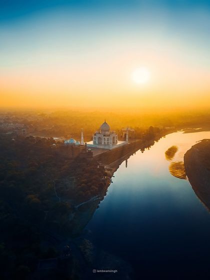 An aerial view of the Taj Mahal at sunrise, captured with my drone. This shot emphasizes the monument's perfect symmetry and its serene location on the banks of the Yamuna.